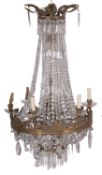 A gilt metal and cut glass hung sixteen light electrolier in Regency style,