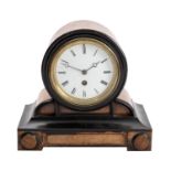 WITHDRAWN A small French walnut and ebonised mantel clock having an eight-day duration timepiece