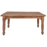 A pine kitchen table, early 20th century, with cleated ends, above plain friezes,