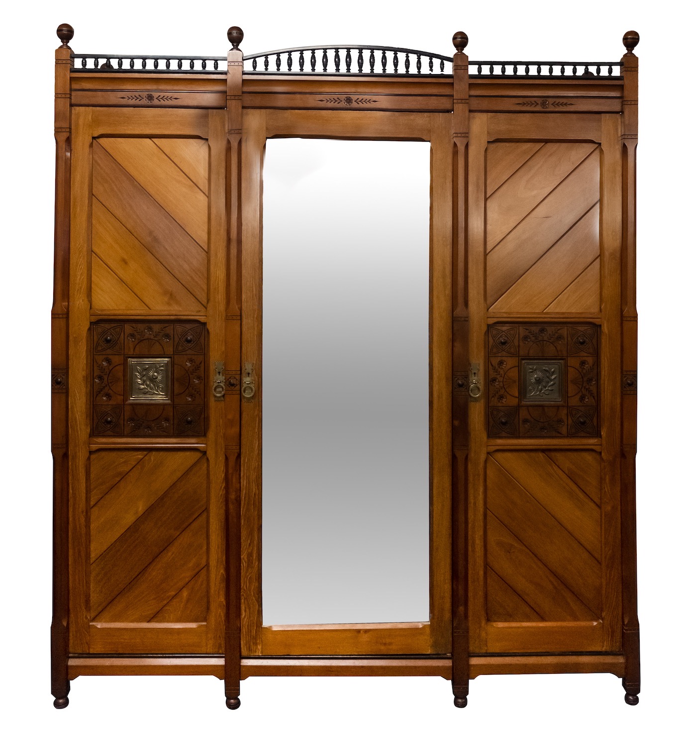 A Victorian oak and walnut wardrobe in Arts & Crafts style,