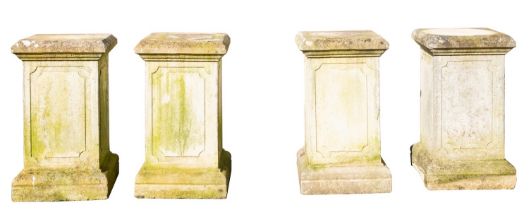 A set of four stone composition garden plinths, 20th century; of square section,