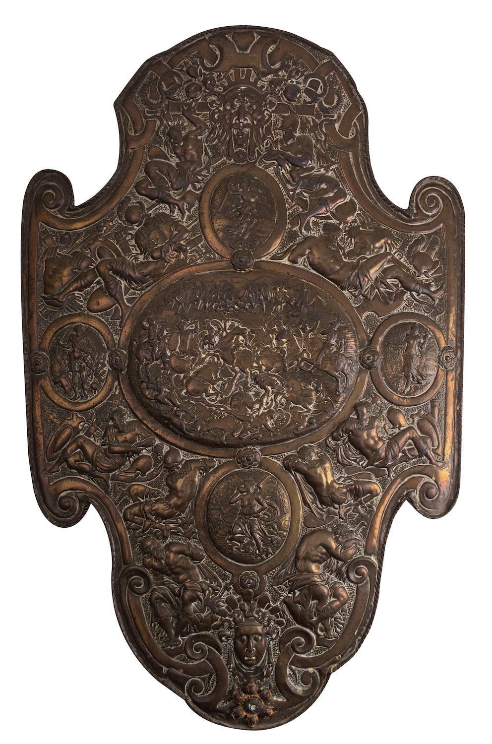 A Continental repoussé worked brass and pine backed model of a shield,