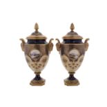 A pair of Coalport porcelain vases and covers with ram's-head handles and pineapple finials,