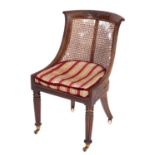 A Regency mahogany and canework library bergere,