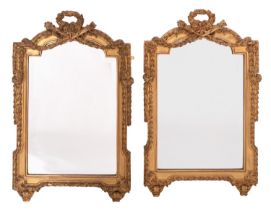 A pair of carved and gilt composition framed wall mirrors in Louis XVI style,