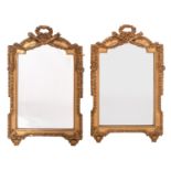 A pair of carved and gilt composition framed wall mirrors in Louis XVI style,