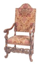 A carved walnut and Damask velvet upholstered elbow chair in Charles II style,
