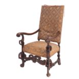 A carved walnut and embroidery upholstered elbow chair in Spanish late 17th century style,