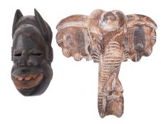 An African carved softwood mask in the form of an elephant, second half 20th century, 40cm high,