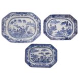 A group of three Chinese blue and white octagonal dishes two painted with lake landscapes,