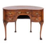 A walnut, burr walnut and banded kidney shape dressing table, in George II style,