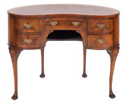 A walnut, burr walnut and banded kidney shape dressing table, in George II style,