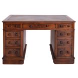 A walnut pedestal desk in Regency taste,