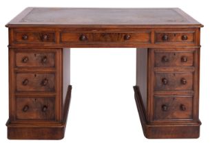 A walnut pedestal desk in Regency taste,