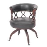A mahogany and upholstered 'cock fighting' elbow chair in Regency style,