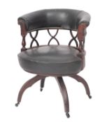 A mahogany and upholstered 'cock fighting' elbow chair in Regency style,