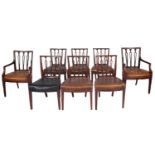 A set of eight late George III mahogany and leather upholstered dining chairs,