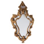A carved and giltwood framed marginal wall mirror in 18th century taste,