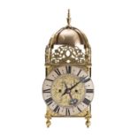 WITHDRAWN An English brass lantern mantel clock the eight-day duration,