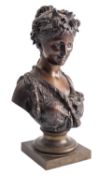 After Jean Bulio (French, 1827-1911), a patinated bronze bust of a Bacchante,