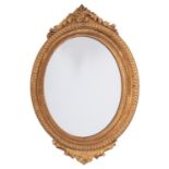 An Italian carved and giltwood framed oval wall mirror in Neoclassical taste,