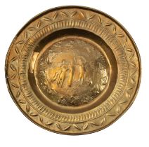 A Continental brass alms dish, probably Nuremberg, early 16th century; repousse worked throughout,