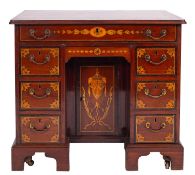 A George III mahogany and marquetry dressing table in the style of a kneehole desk,