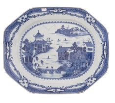 A large Chinese blue and white octagonal meat dish painted with a traditional pagoda lake landscape,