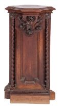 A Victorian carved and stained walnut corner plinth in Gothic taste,