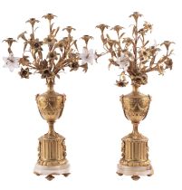A pair of gilt metal and onyx mounted seven light candelabra, in Louis XV style,