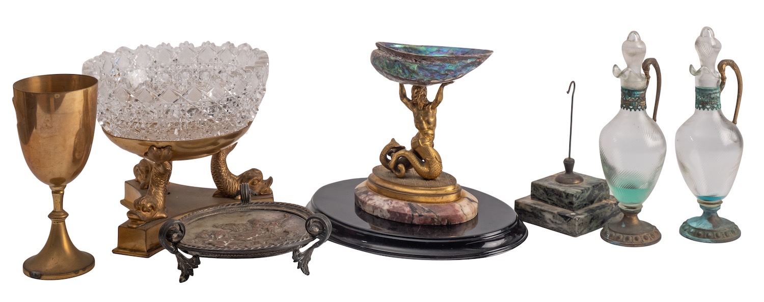 A gilt bronze, marble and abalone shell mounted centrepiece cast as a triton,