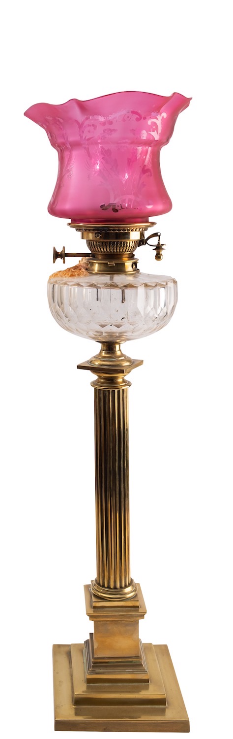 A late Victorian or Edwardian brass and glass mounted columnar table oil lamp,