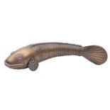 An Indian brass articulated fish, early 20th century; with red glass eyes; 17.5cm long.