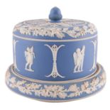 A pale blue jasper ware stilton dome, with an acorn knop,