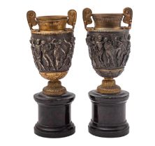 A matched pair of patinated and gilt metal models of the Townley Vase,