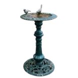 A painted cast iron bird bath,