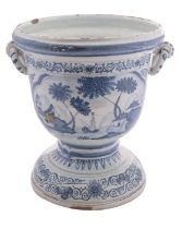 A large Dutch Delft blue and white jardiniere with rope twist handles,
