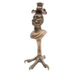 A gilt brass table lighter in the form of a bust of a slave, adapted as a candlestick,