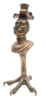 A gilt brass table lighter in the form of a bust of a slave, adapted as a candlestick,