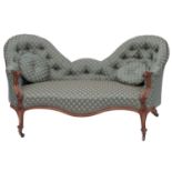 A Victorian carved walnut and upholstered conversation sofa,