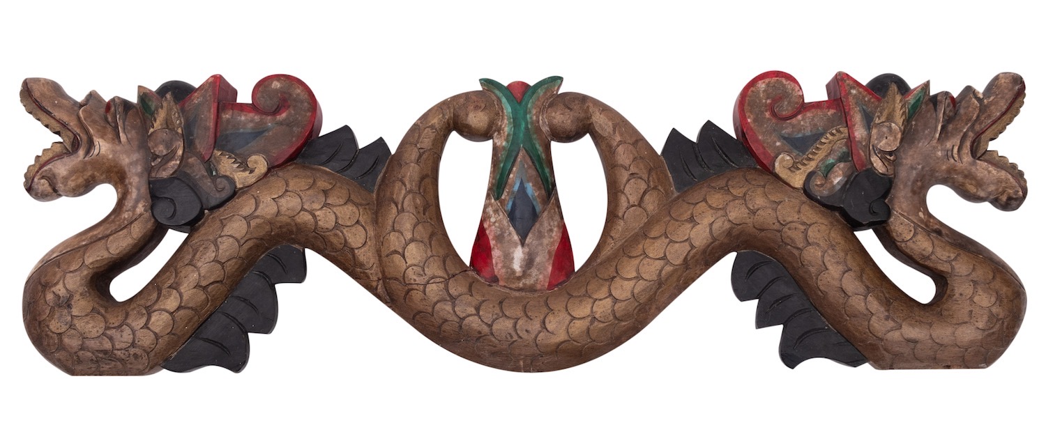 An Indonesian carved and painted wood transom in the form of a double headed serpent, 63cm.