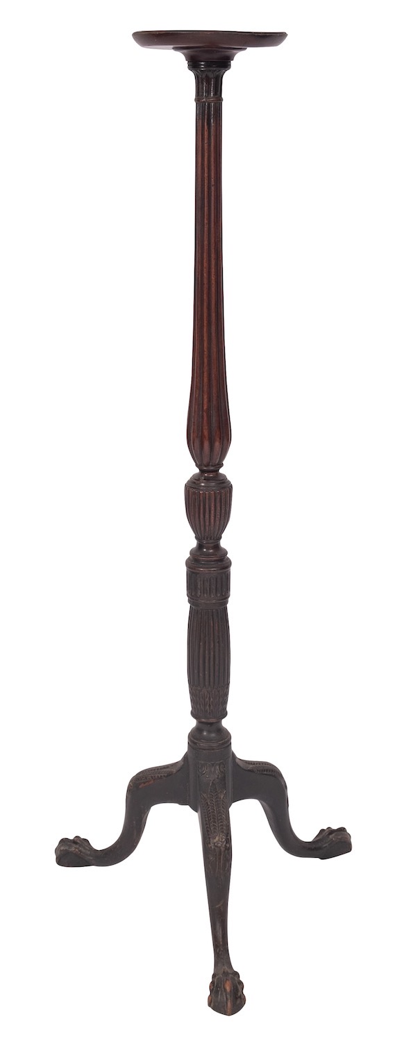 A mahogany torchere stand in George II style, 19th century; the circular top with moulded edges,