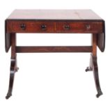 A Regency mahogany, crossbanded and line inlaid sofa table,