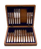 A case part set of silver fruit knives a