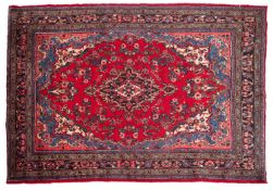 A Hamadan carpet, the red shaped lozenge