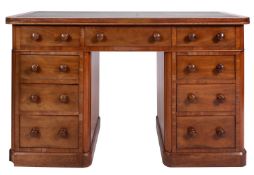 A mahogany pedestal desk in Regency styl