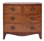 A late George III mahogany bowfront chest of drawers, circa 1800; the top with reeded edges,