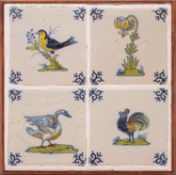 Four Dutch delft polychrome decorated tiles, three painted with birds and one with a flower,