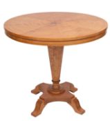 A maple and parquetry centre table in Bi