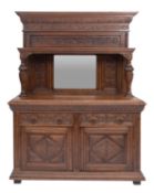 A carved oak side cabinet in Flemish 17t